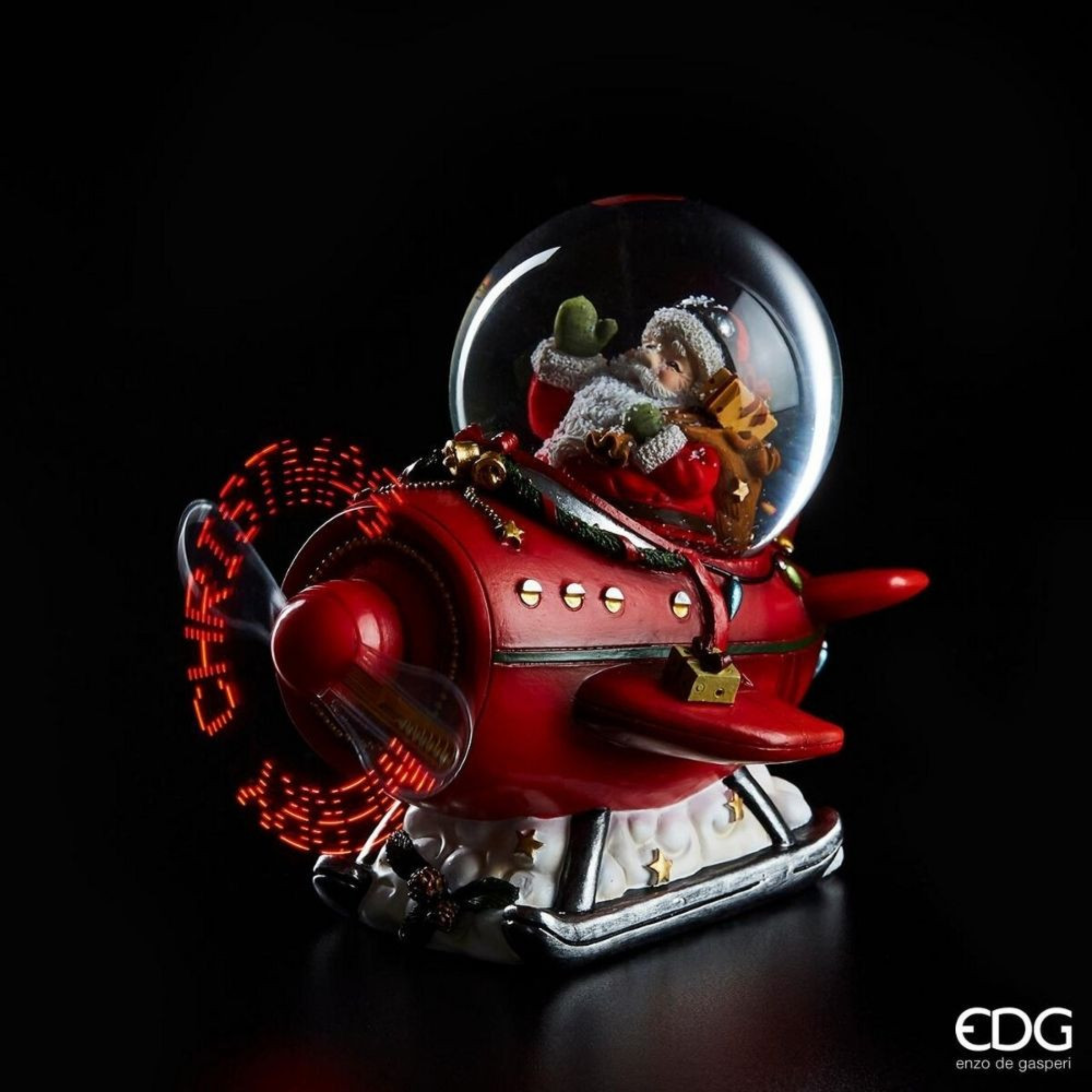Sfera Natalizia Babbo Natale su aereo con eliche a LED con scritta “Merry Christmas” ed effetto nevicata cm 16x14 15h