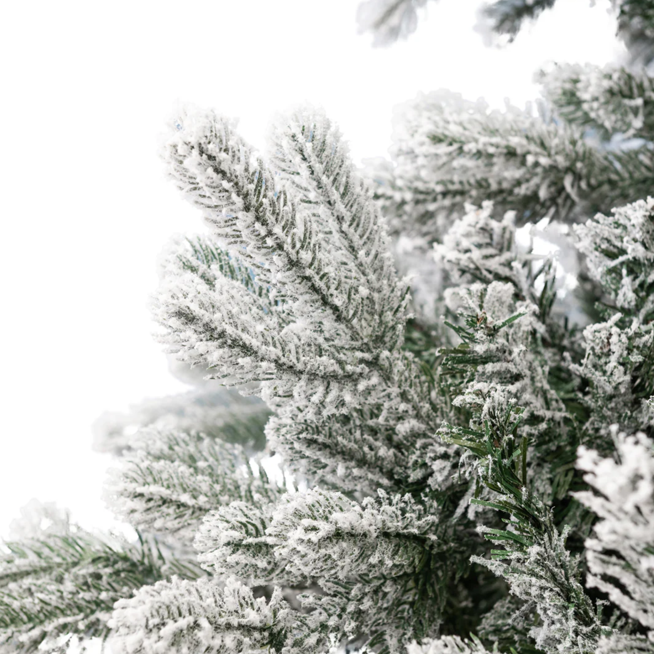 Albero di Natale innevato "Piuma" in PE effetto Real Touch + Flock di altissima qualità